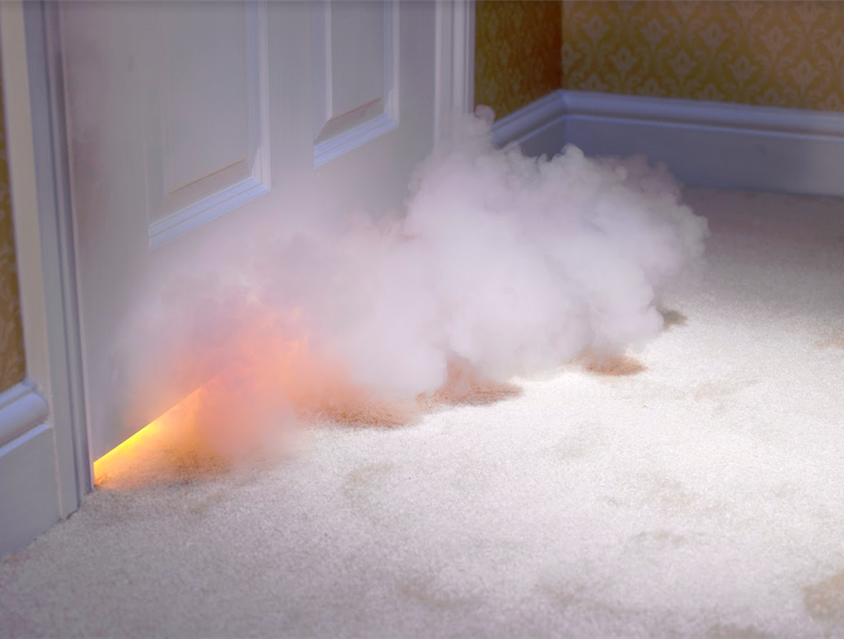 smoke coming out from under a door