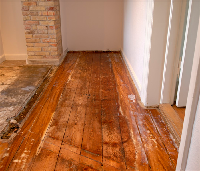 a water damaged wood floor in a home